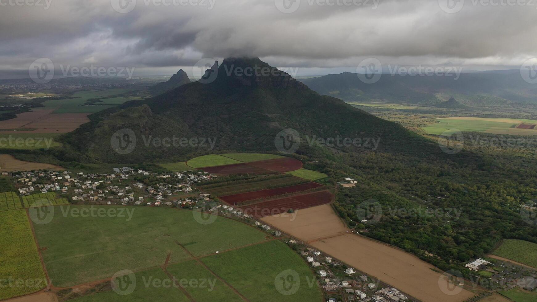 Aerial photography of the beautiful green countryside of Mauritius with fields and mountain views. photo