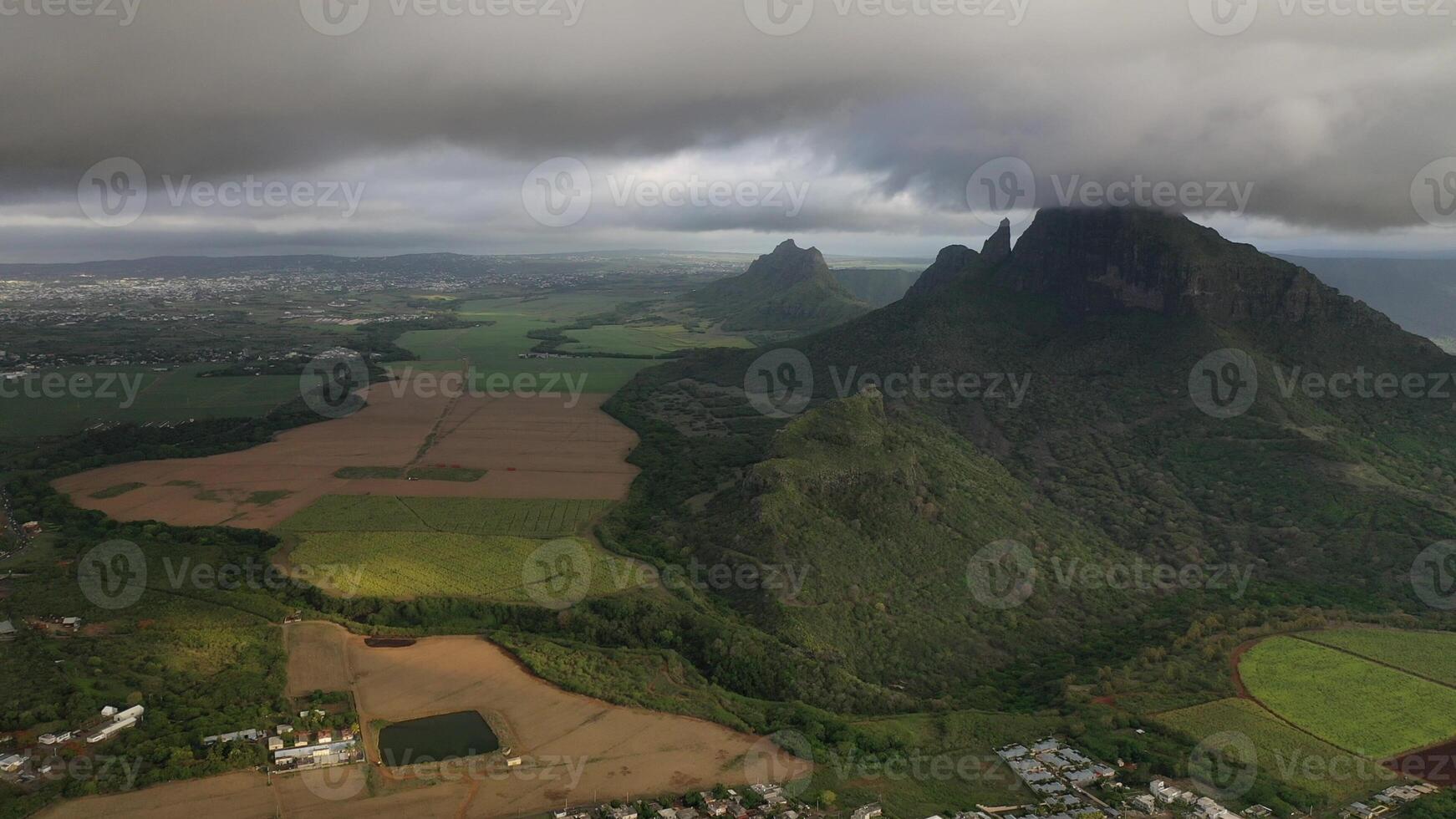 Aerial photography of the beautiful green countryside of Mauritius with fields and mountain views photo