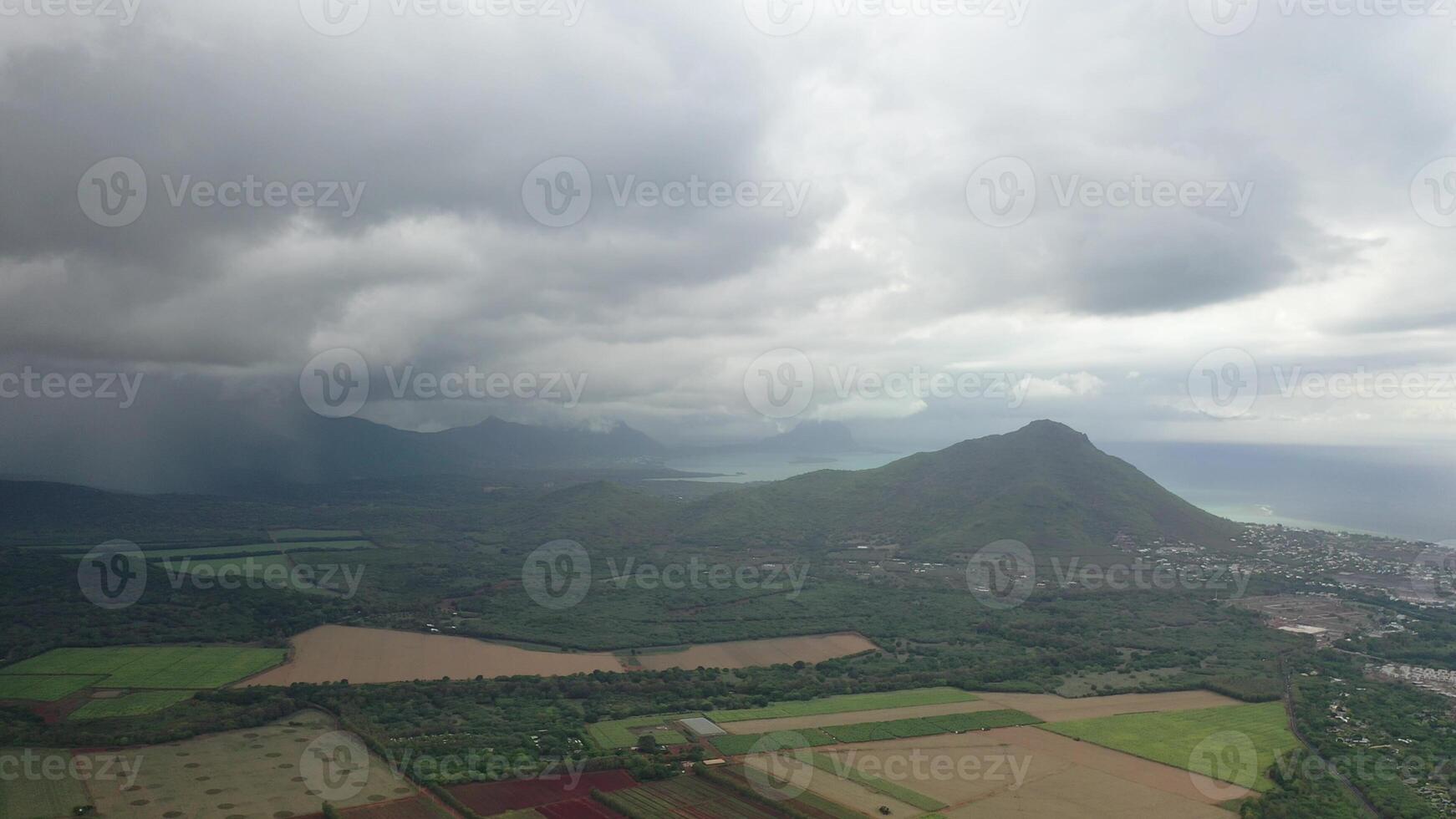 top view of rural fields and rain in the distance, Mauritius photo