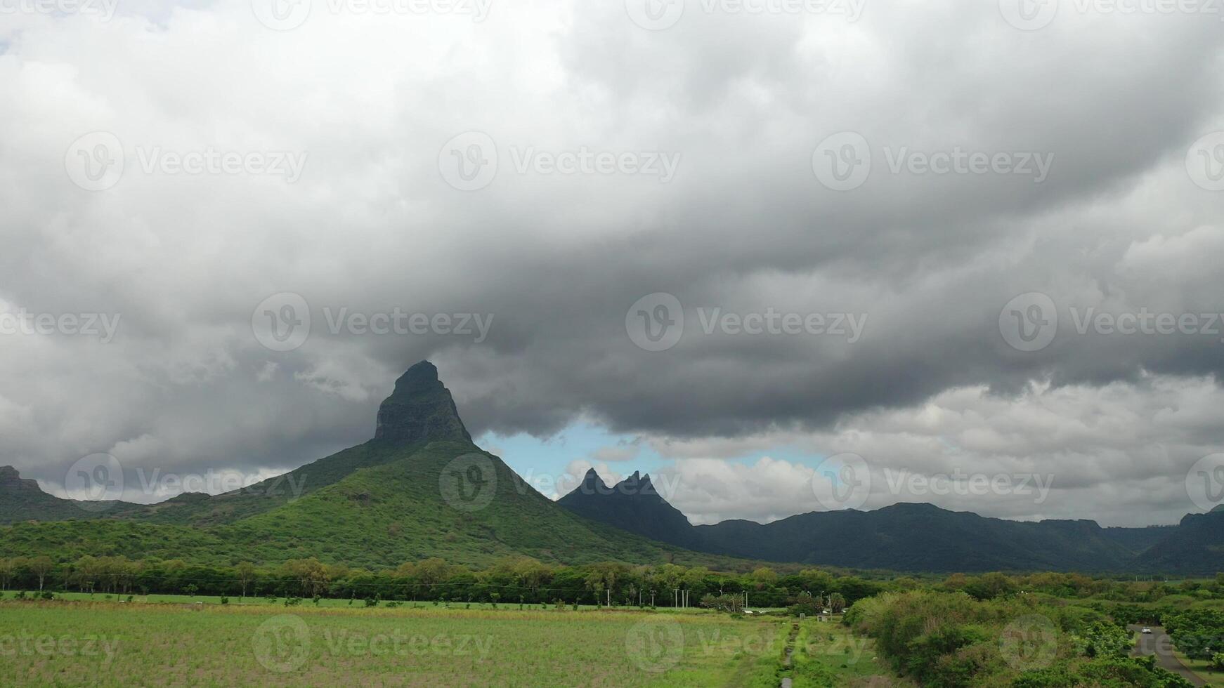 Mauritius, endless green fields and mountain tops in the clouds photo