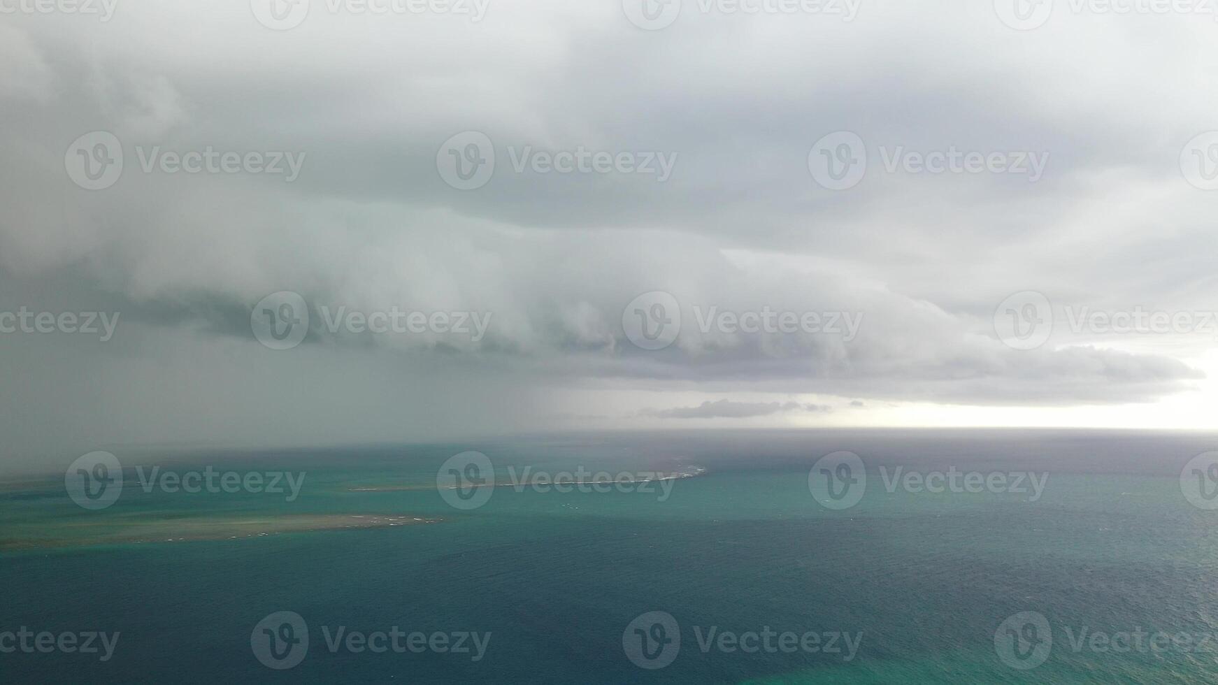 Storm clouds in the sky when it moves over the ocean. Epic tropical storm clouds. Indian ocean photo