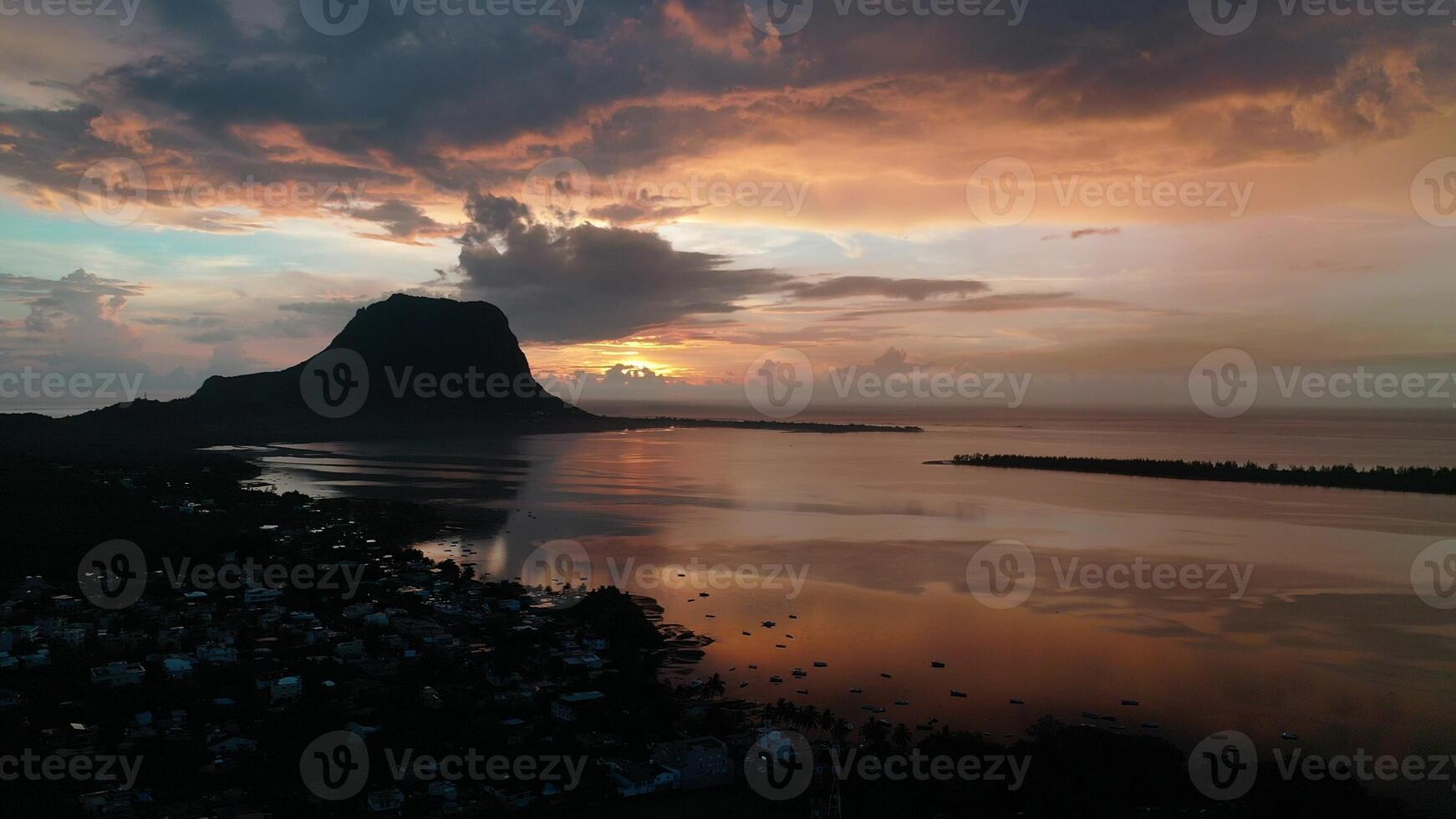 Amazing sunset from the height of mount Le Morne Brabant and the waves of the Indian ocean in Mauritius .Underwater waterfall near mount Le Morne in the Indian ocean. photo