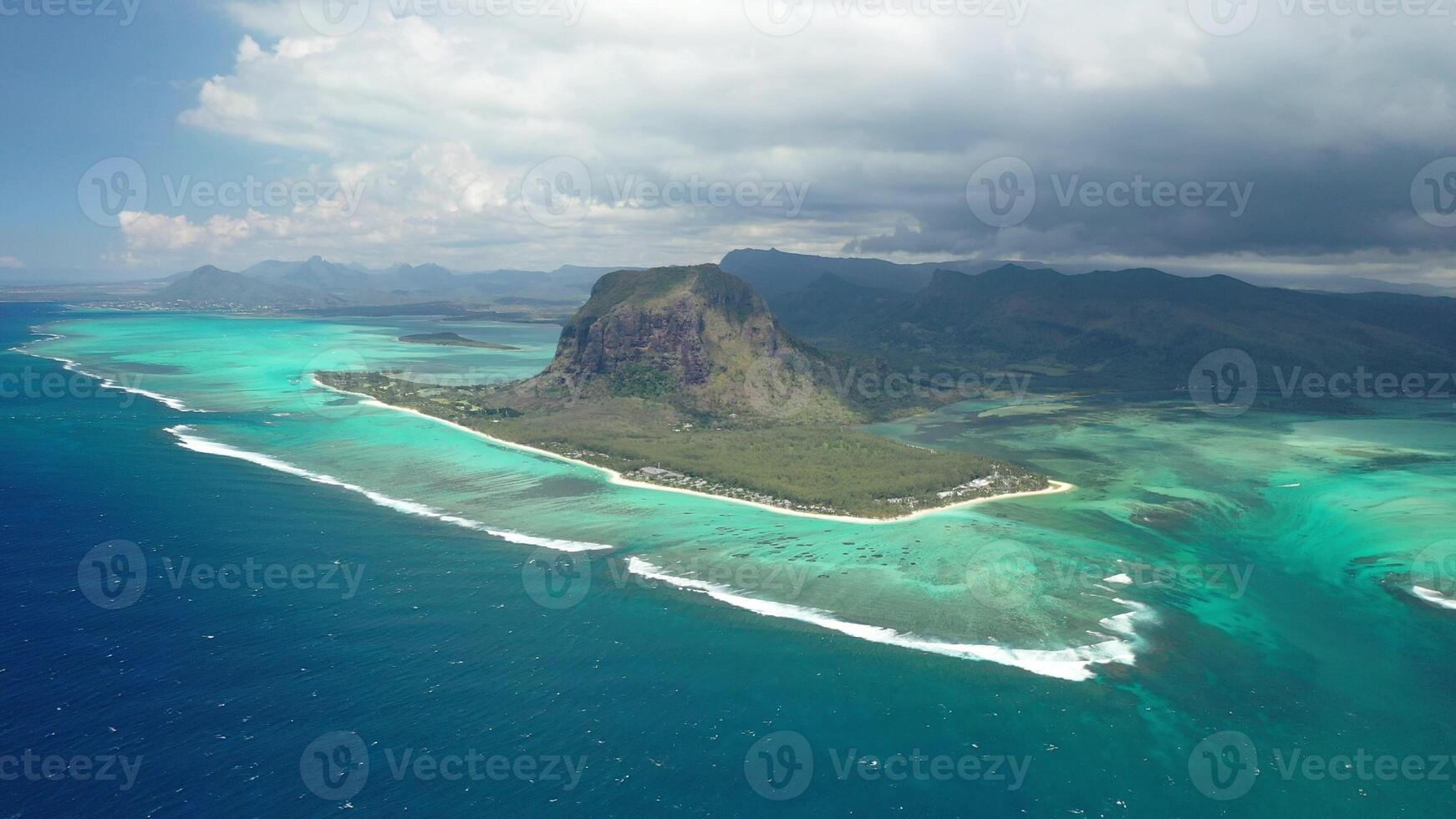 Beautiful bird's-eye view of mount Le Morne Brabant and the waves of the Indian ocean in Mauritius.Underwater waterfall near mount Le Morne in the Indian ocean photo