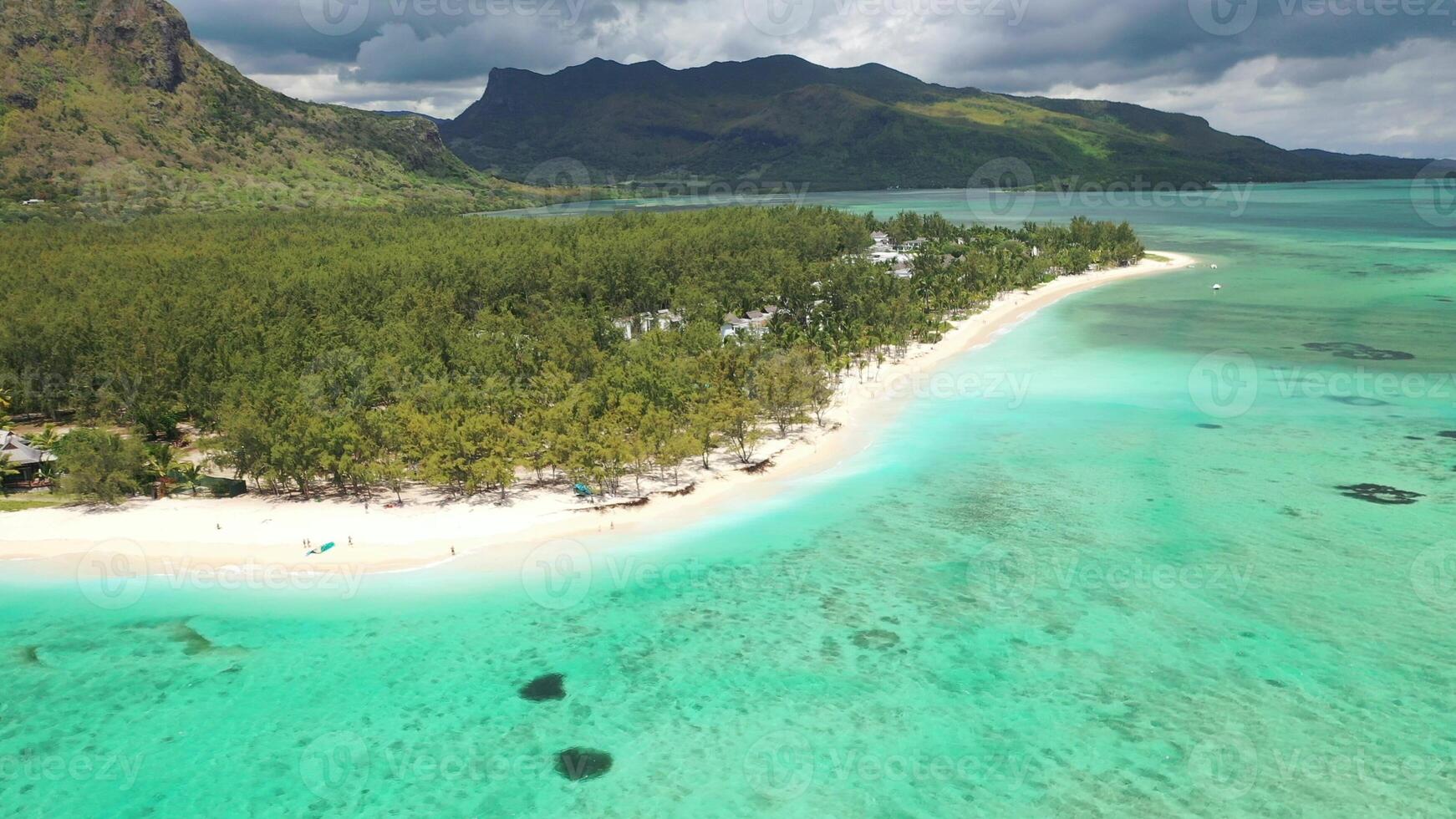 Beach with luxury hotel, white sand and turquoise water of the Indian ocean, Mauritius, Africa photo