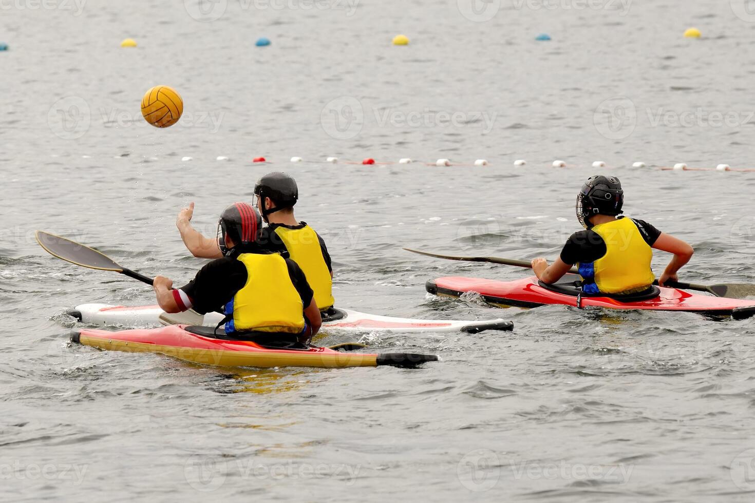 People in kayak playing polo photo