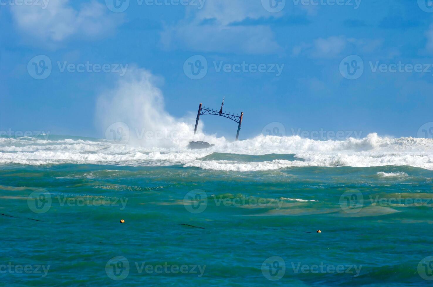 Sunken ship wreck and stormy sea photo