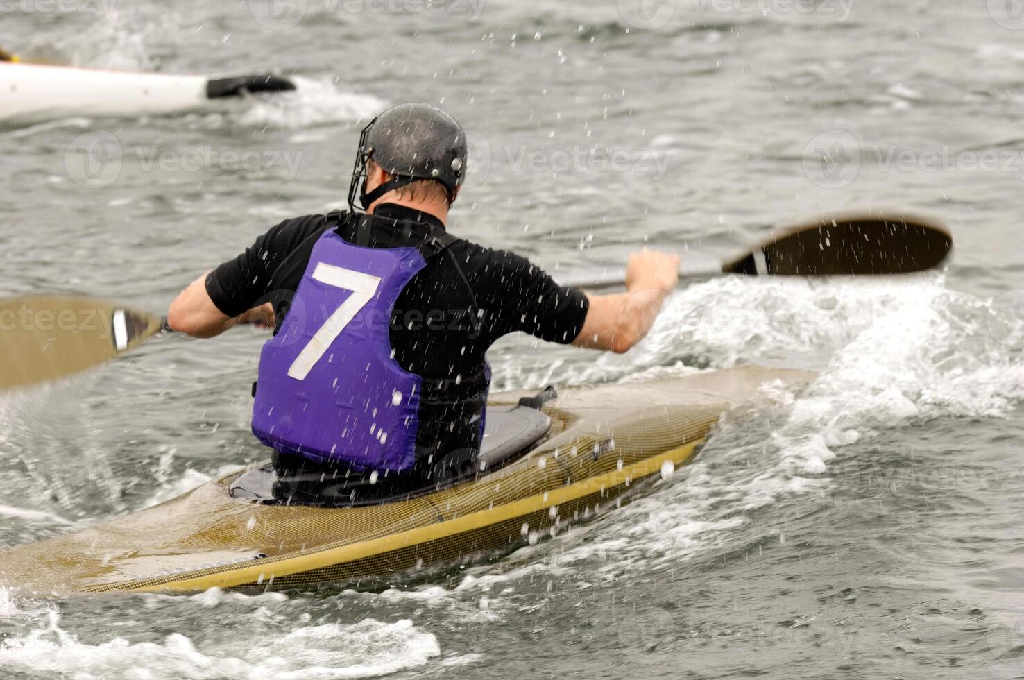 Man in kayak race photo