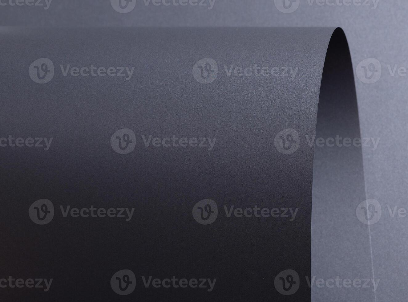 Designer paper background with a dark gray, wavy texture and subtle gradient. Featuring a crinkled, photo
