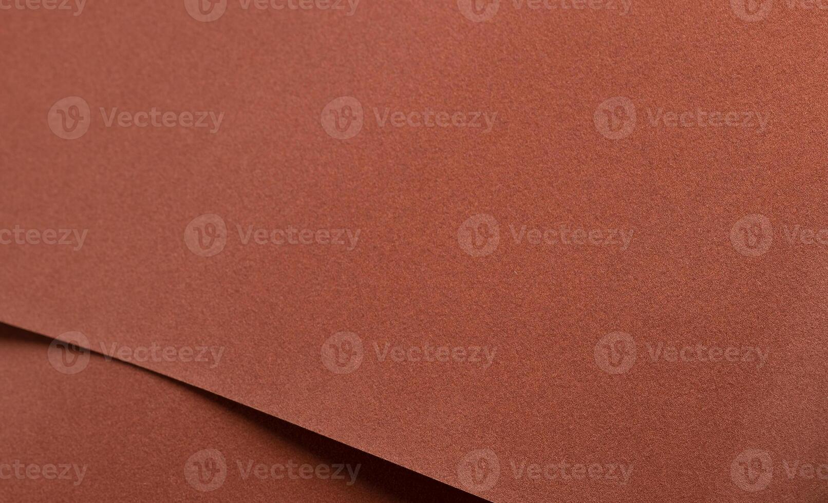 Abstract designer paper background with a velvety, warm matte texture in rich earthy tones. photo