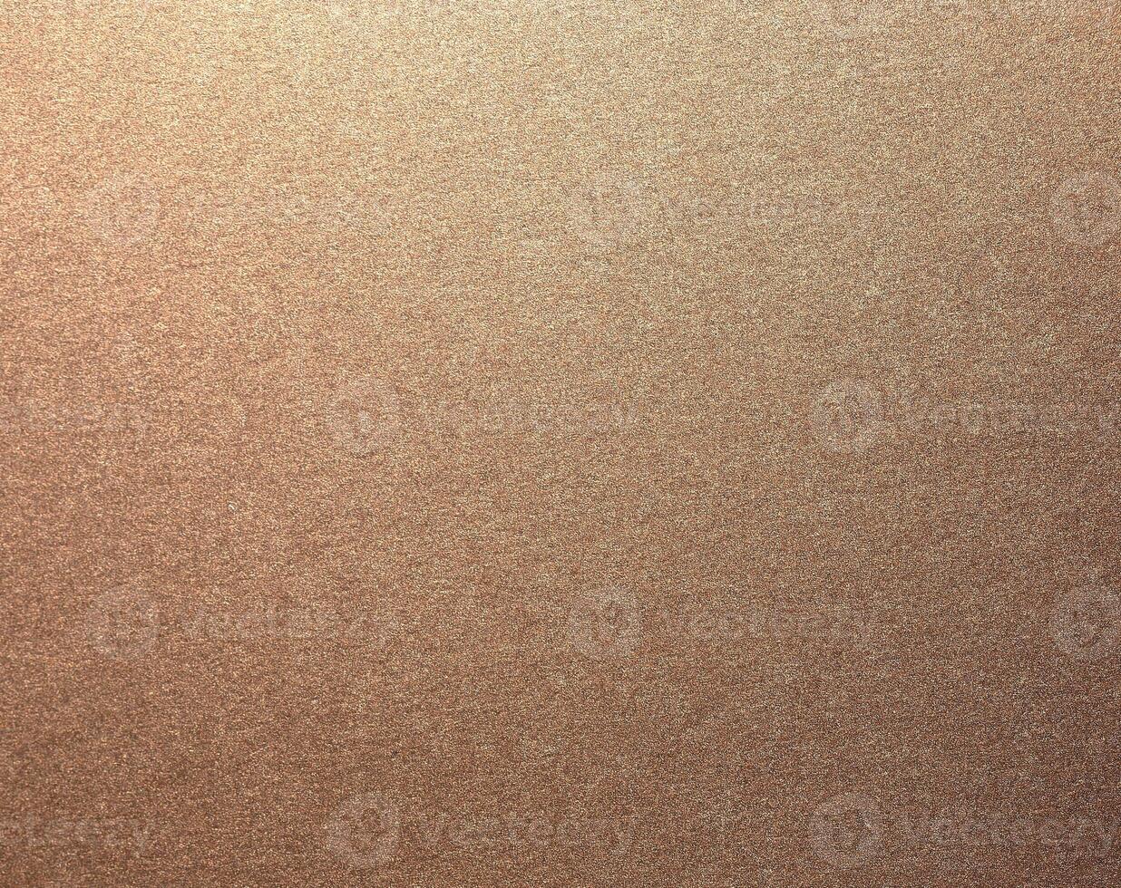 Glossy designer paper background with a rich bronze and copper gradient, featuring a warm, grainy photo