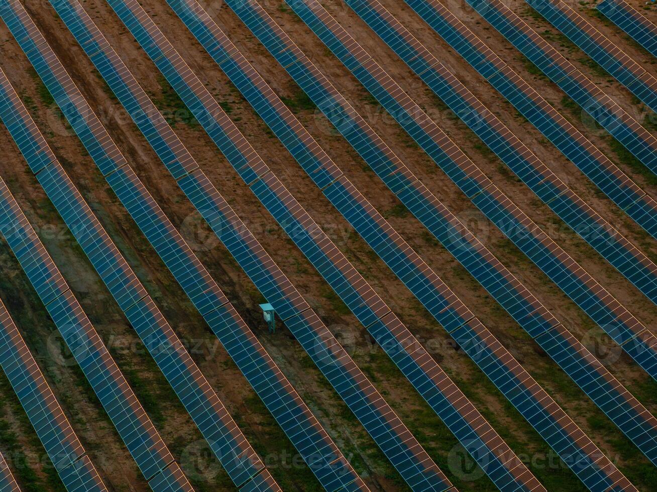 Aerial View of Solar Panel Farm in Lithuania with Geometric Patterns photo