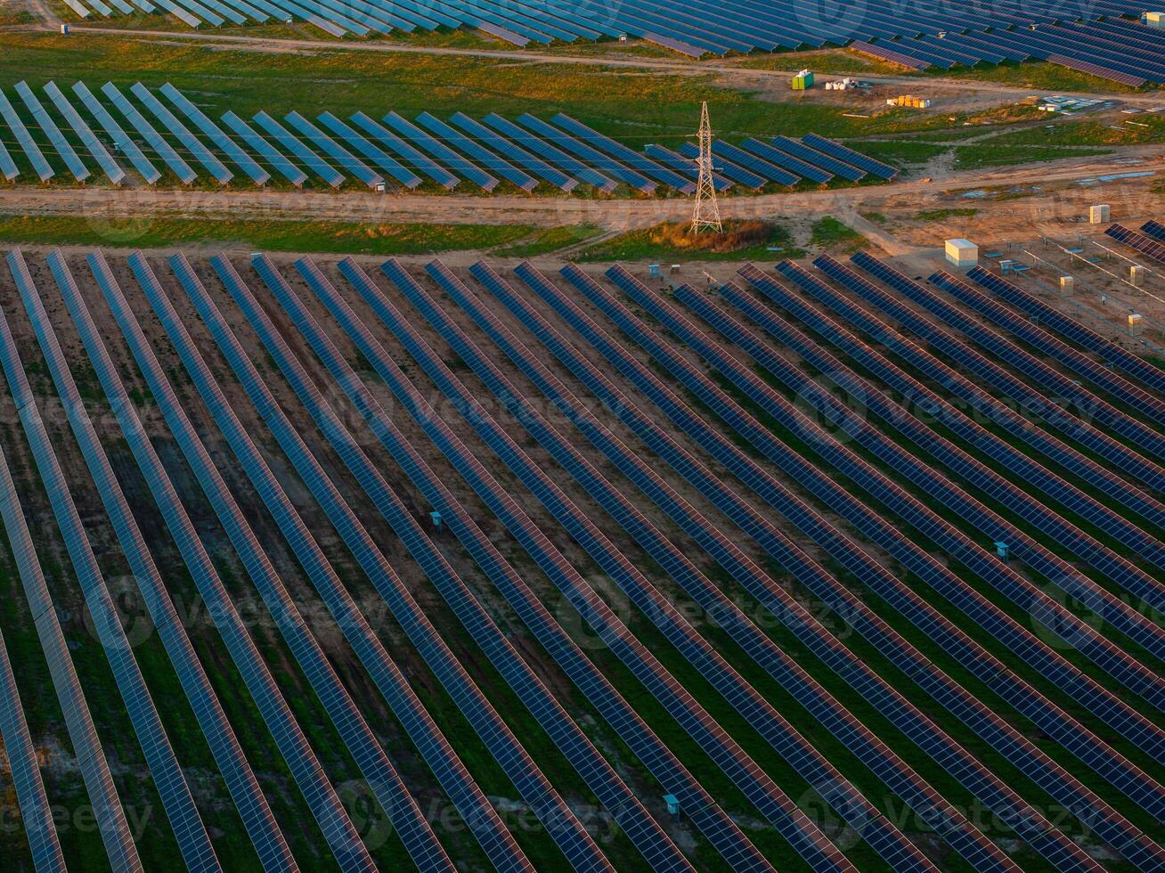 Aerial View of Solar Farm and Transmission Tower in Lithuania photo