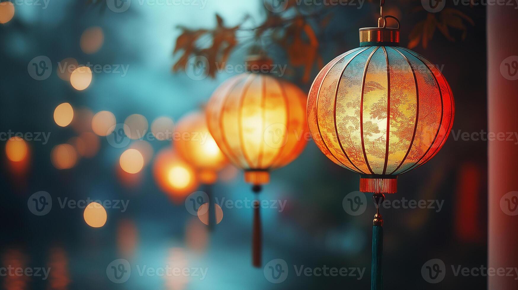 Lanterns hanging from a tree in the dark photo