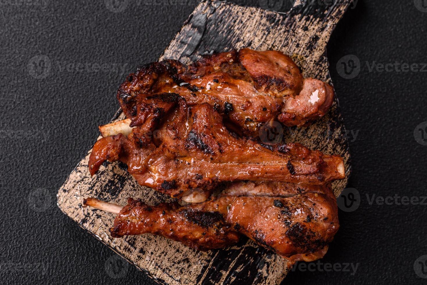 Ribs or rack of beef baked on the grill with salt, spices and herbs photo