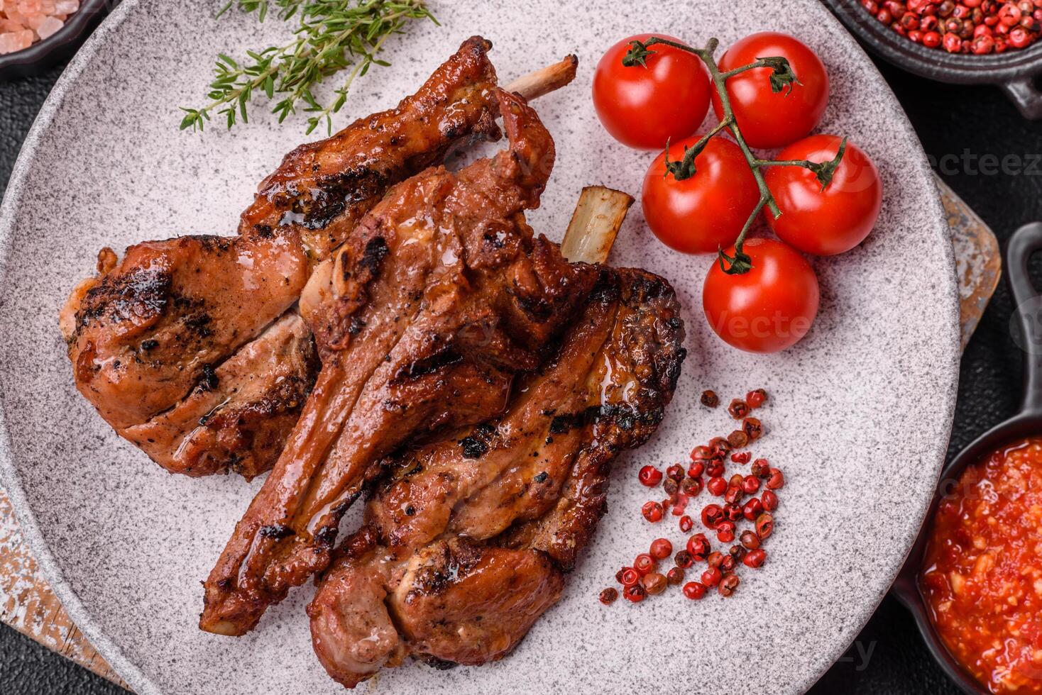 Ribs or rack of beef baked on the grill with salt, spices and herbs photo