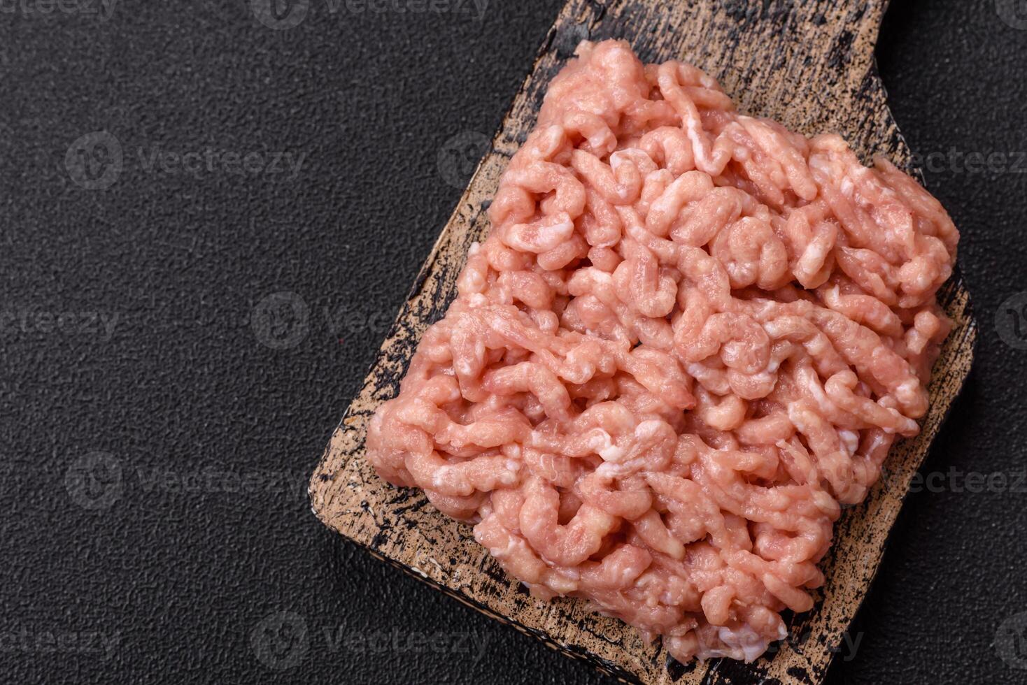 Raw minced chicken with salt, spices and herbs photo