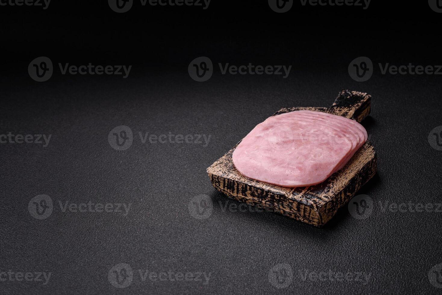 Ham, spam with salt, spices and herbs cut into slices photo