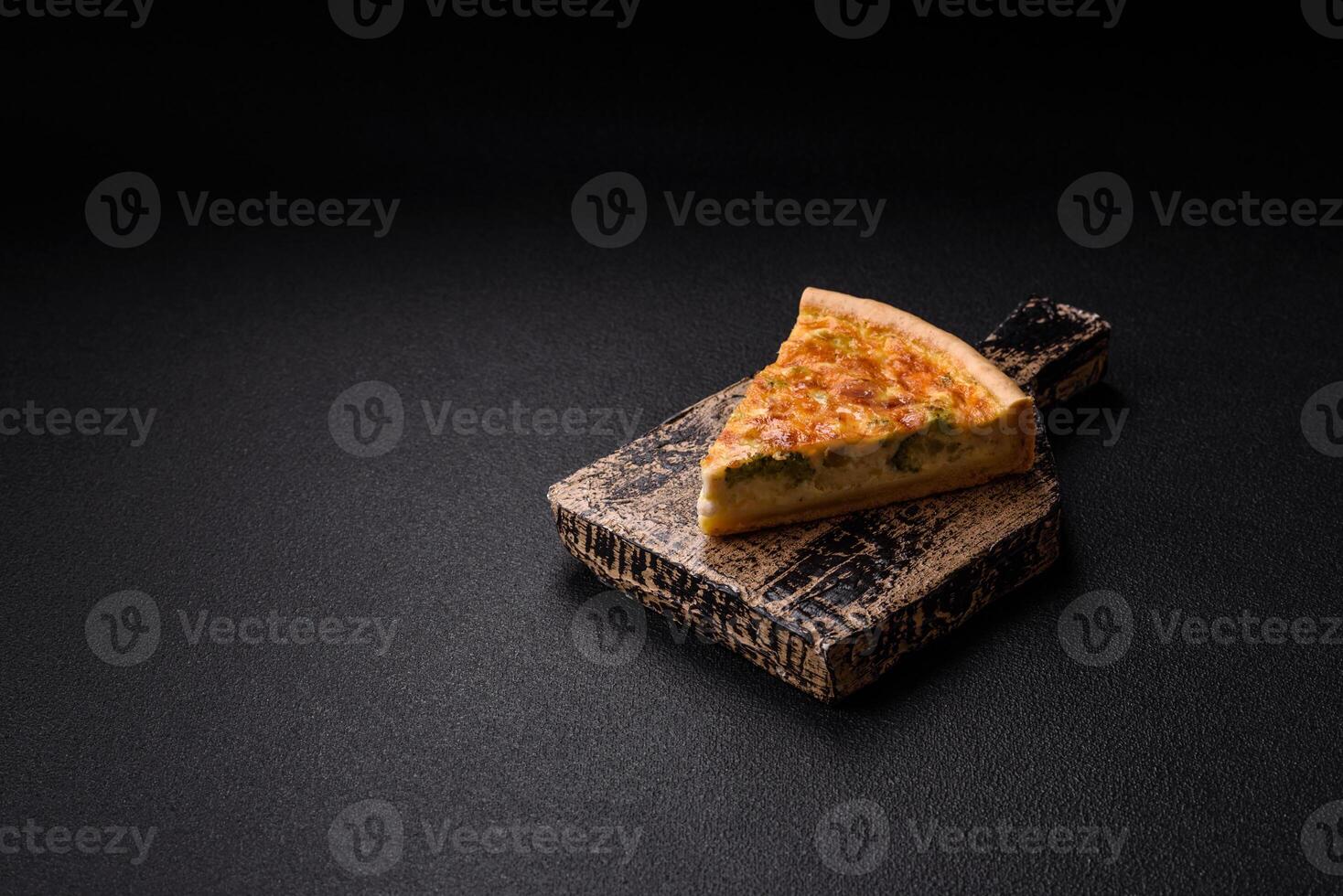 Delicious quiche with broccoli, chicken or salmon and cheese photo