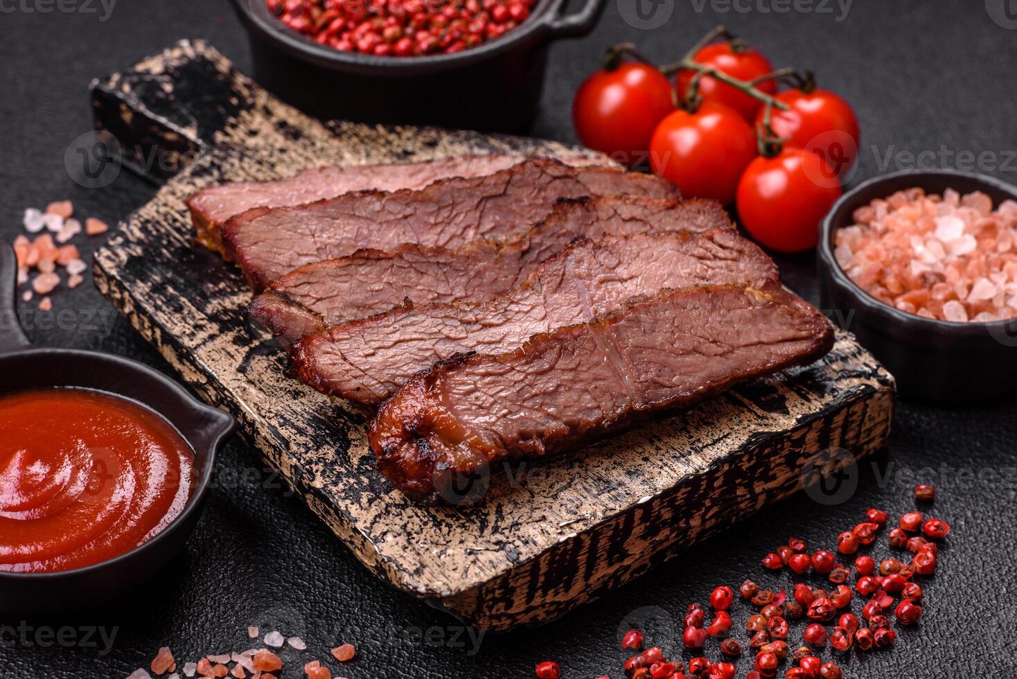 Grilled wagyu beef tomahawk steak with salt, spices and herbs photo
