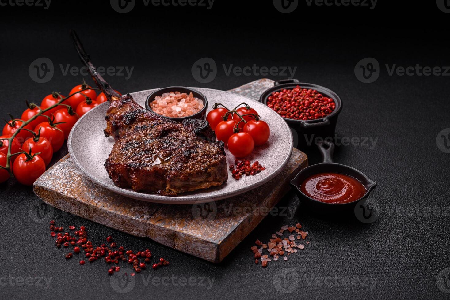 Grilled wagyu beef tomahawk steak with salt, spices and herbs photo