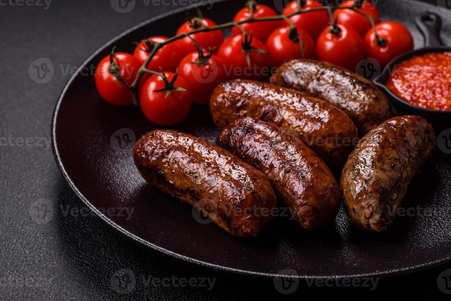 Juicy sausages with salt, spices and herbs photo