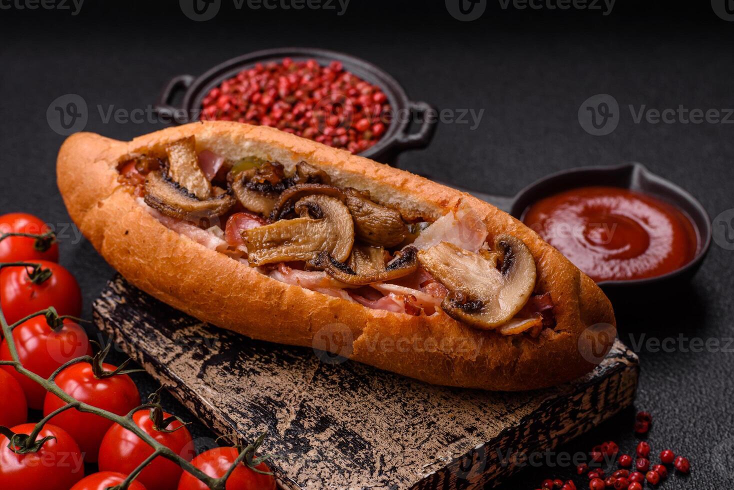 Hotdog with grilled sausage with bacon and mushrooms photo