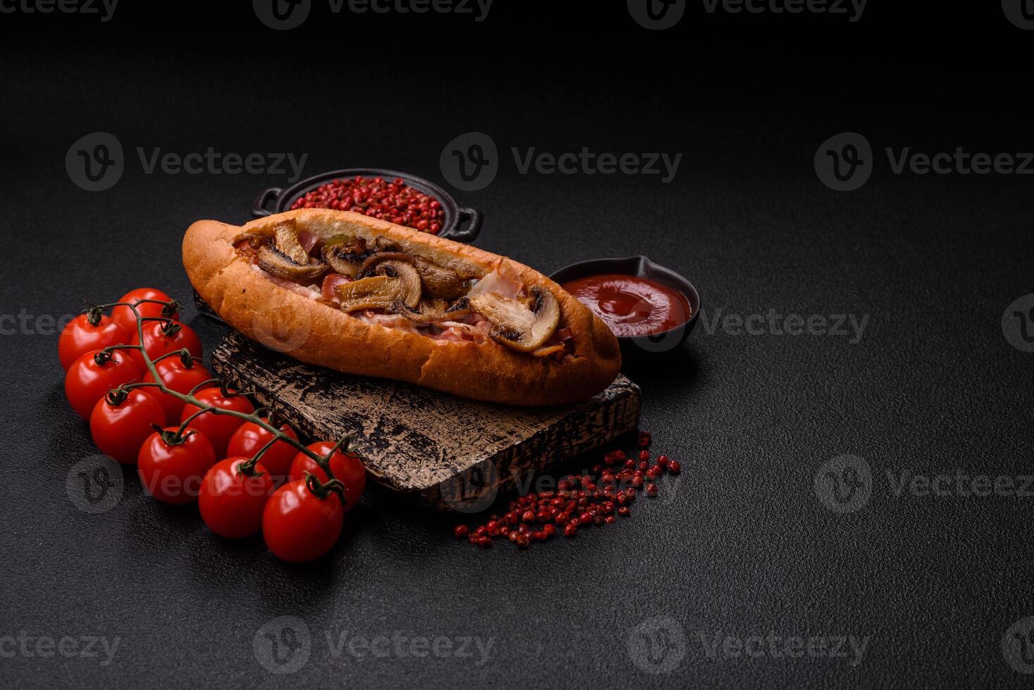 Hotdog with grilled sausage with bacon and mushrooms photo