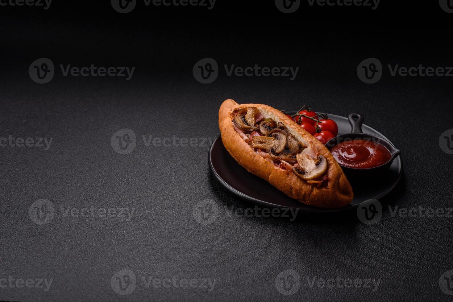 Hotdog with grilled sausage with bacon and mushrooms photo