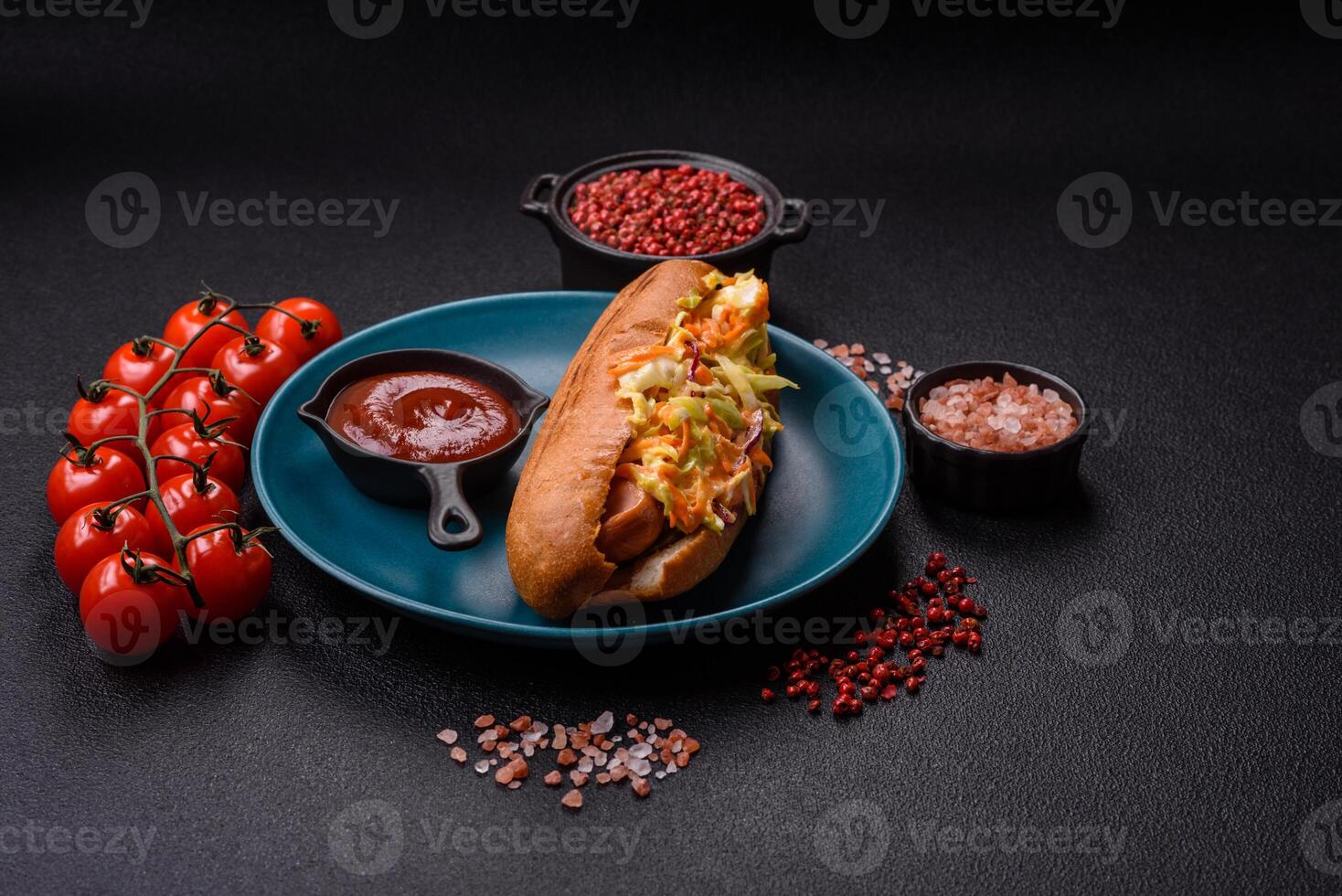 Hotdog with grilled sausage with cabbage, carrots and onions photo