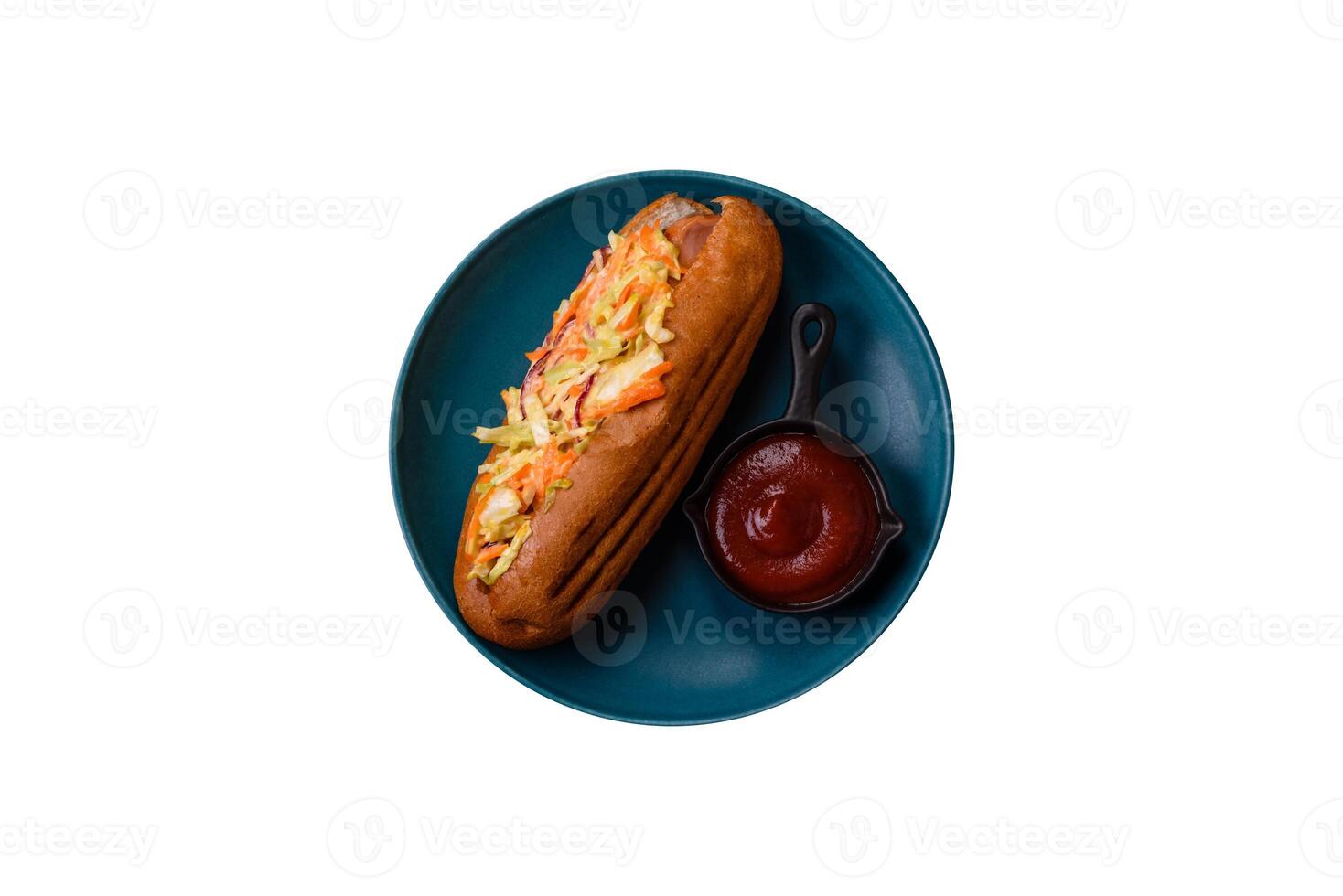 Hotdog with grilled sausage with cabbage, carrots and onions photo