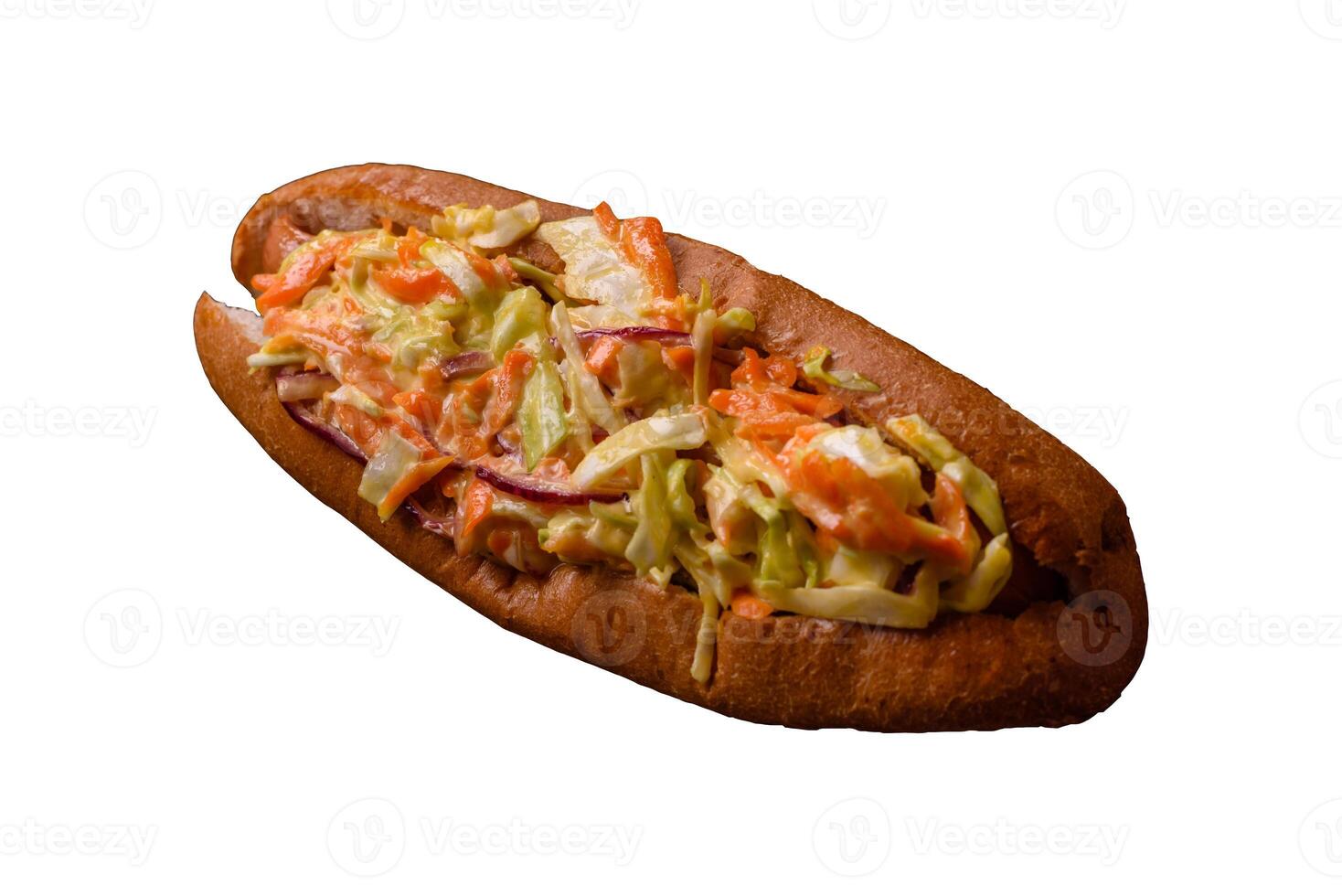 Hotdog with grilled sausage with cabbage, carrots and onions photo