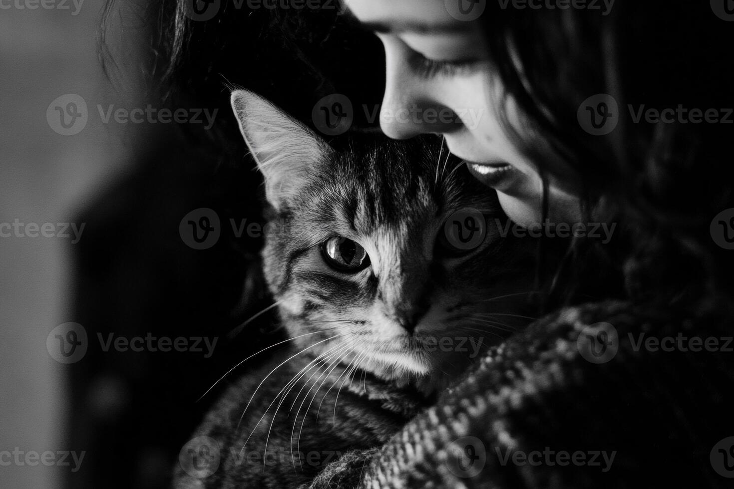 Young woman embracing and showing affection to her lovely cat photo