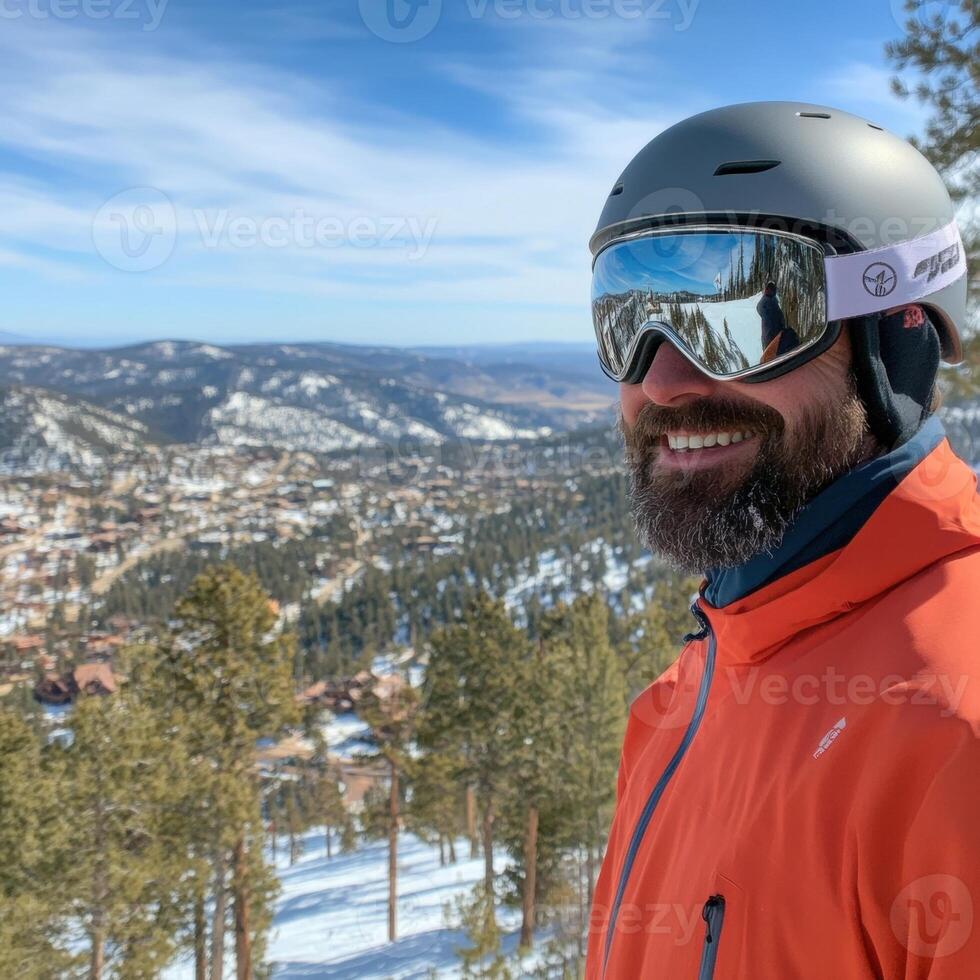 Smiling skier enjoying mountain view in winter vacation photo