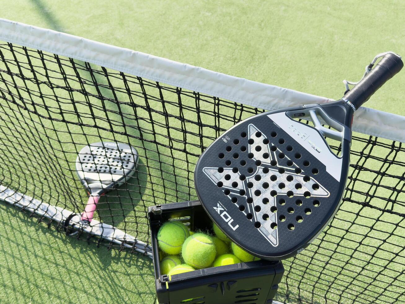 Kyiv, Ukraine, October 23, 2024. padel racket nox on a padel court with a ball photo