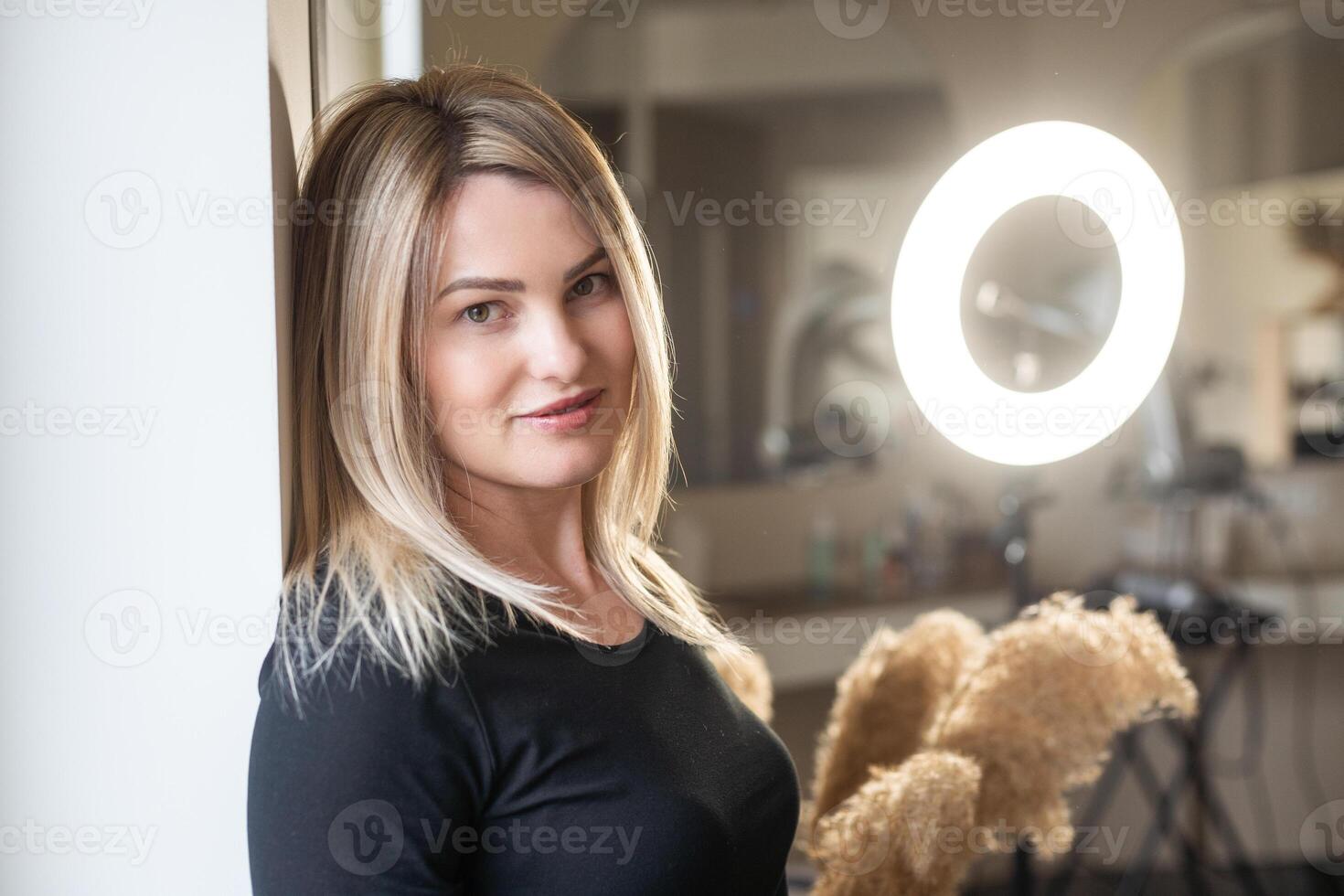 Confident smiling middle aged business woman attorney, lady entrepreneur, mature female professional executive manager leader standing in office looking at camera. Portrait. photo
