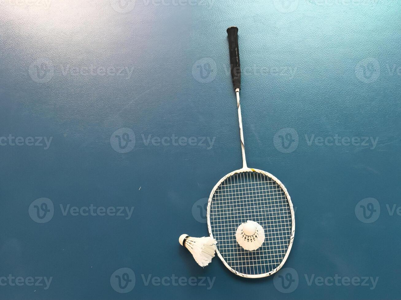 badminton racket and shuttlecock closeup photo