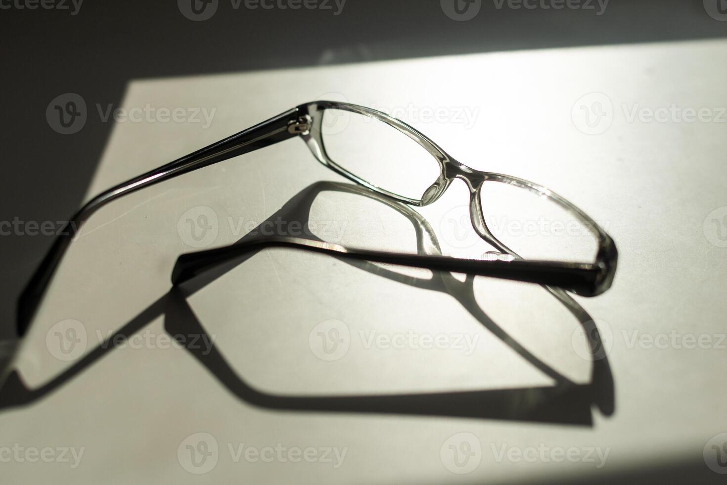 Black frame eyeglasses isolated on white background, Myopia, Short sighted or presbyopia eyeglasses. photo