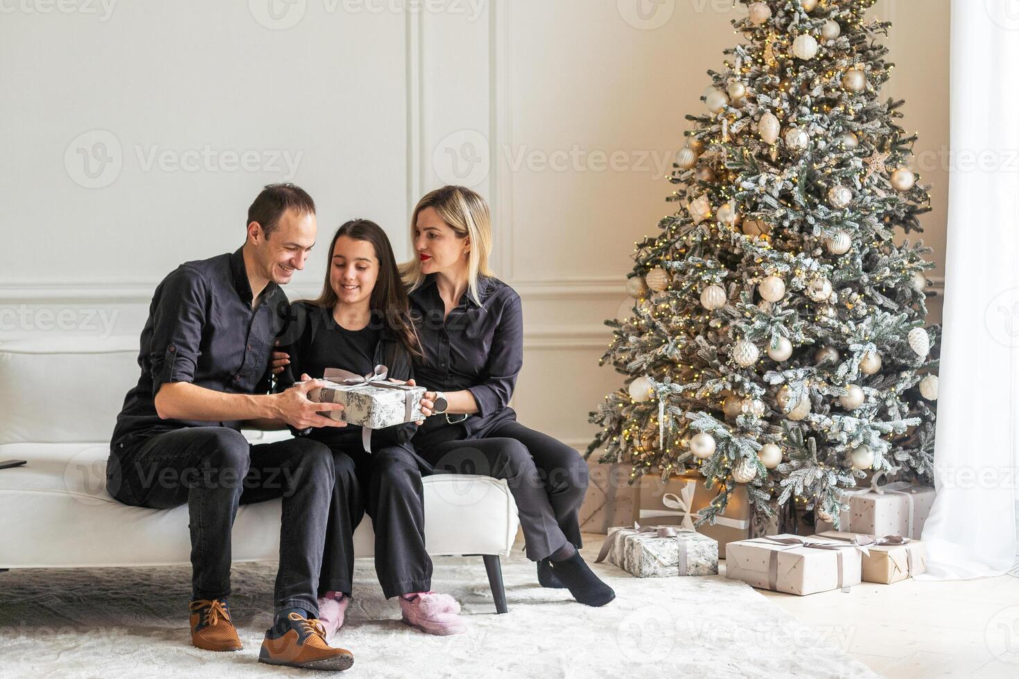 Christmas, happy family and funny together in home. Xmas, smile and face of parents with girl, celebration and holiday photo