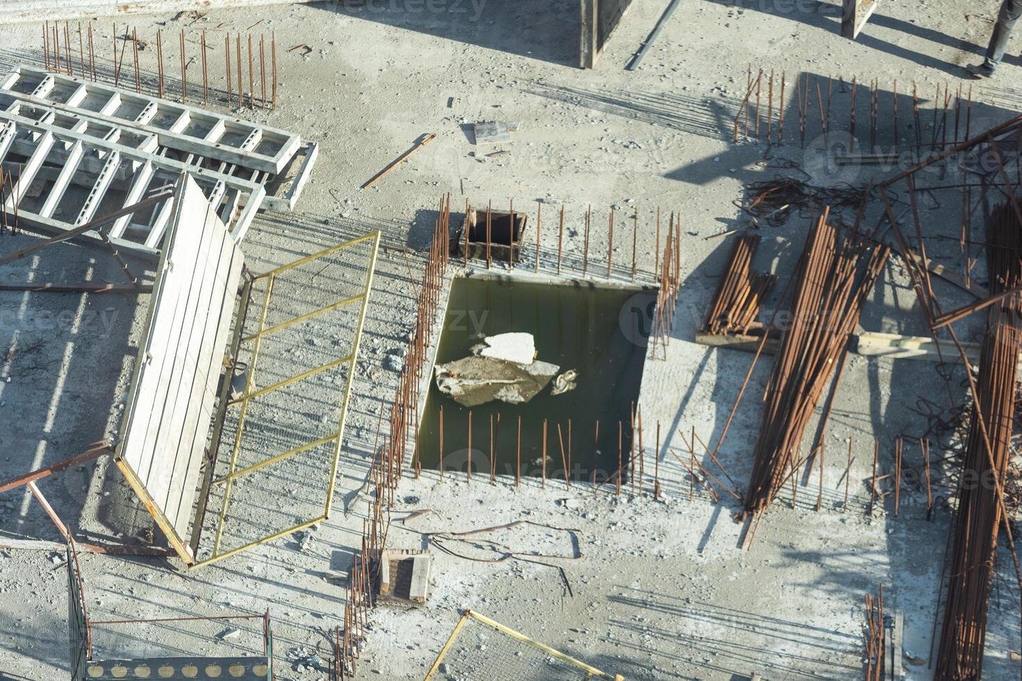 Concrete drainage pipes at the construction site. Laying of underground storm sewer pipes. Installation of water main, sanitary sewer. Installation of concrete sewer wells in the ground photo