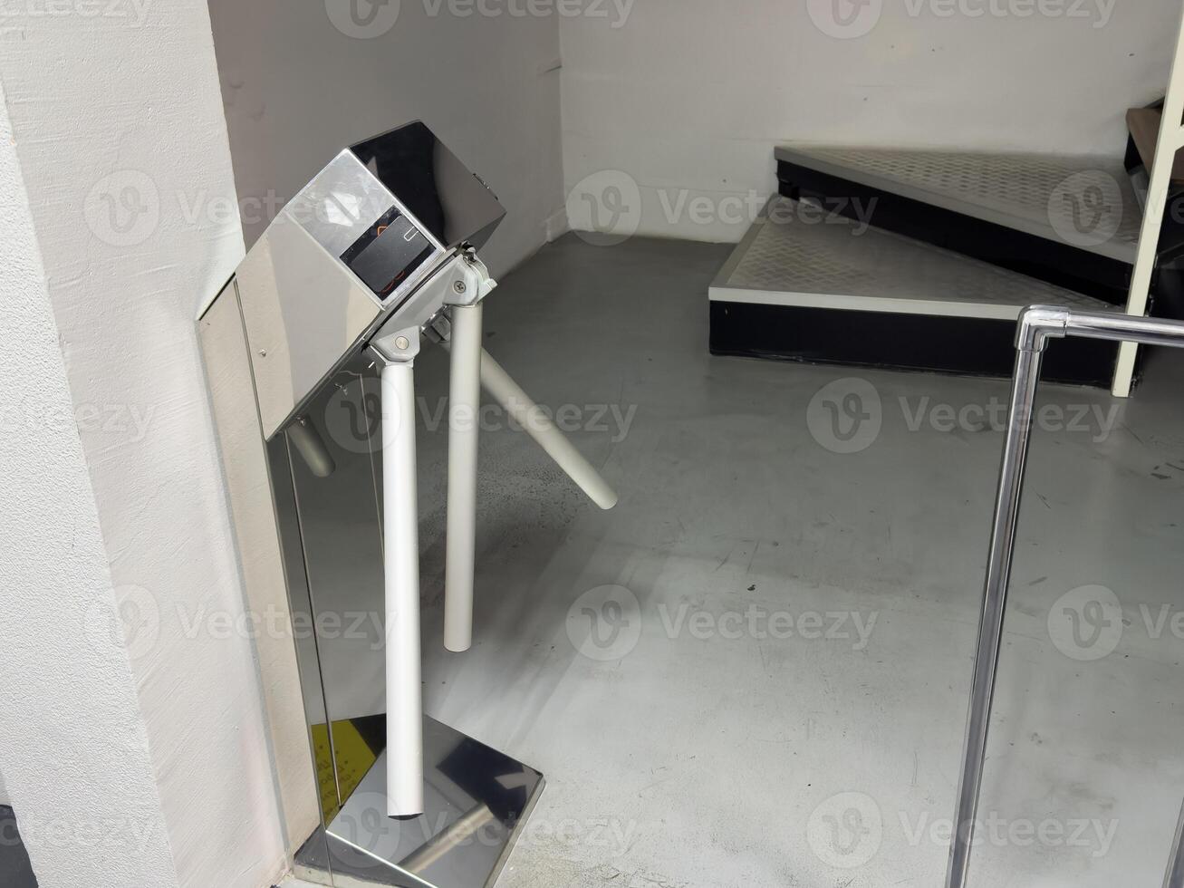 Entrance with turntables. A checkpoint with a turnstile. Turnstile with card reader. Electronic checkpoint. We pass on the territory. Incoming people control. Subway entrance. photo