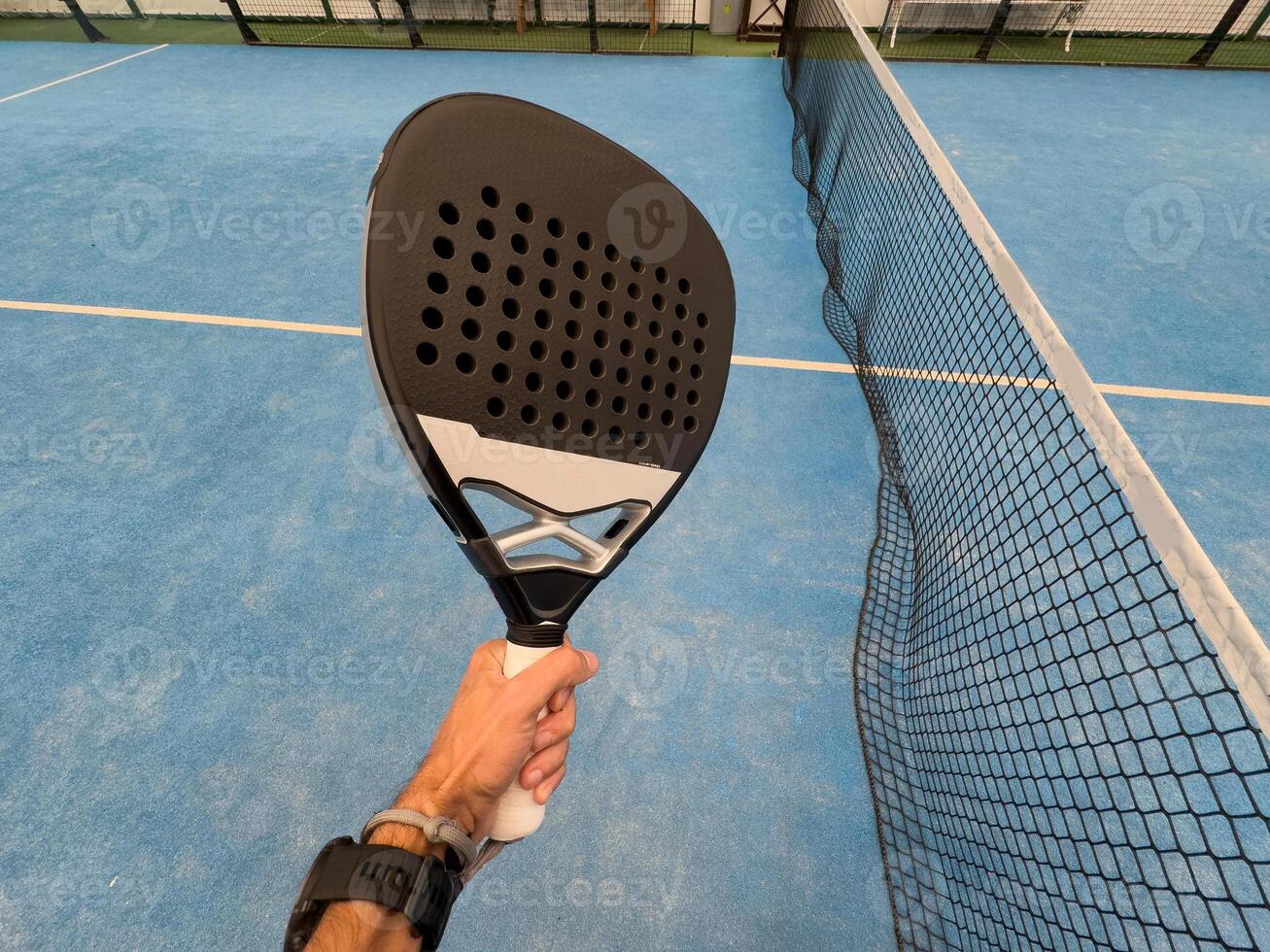paddle tennis player, hands and racket ready for serve photo