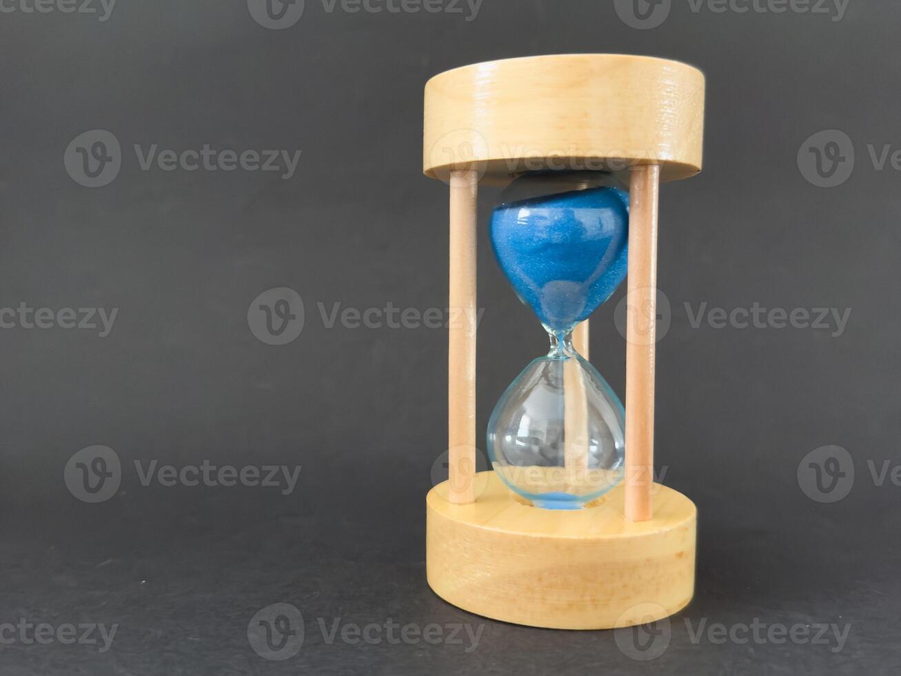 Modern hourglass background. Hourglass time concept for business deadline, urgency and outcome of time photo