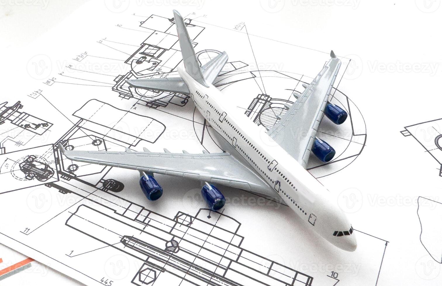 Image of passenger airplane and engineering blueprint photo