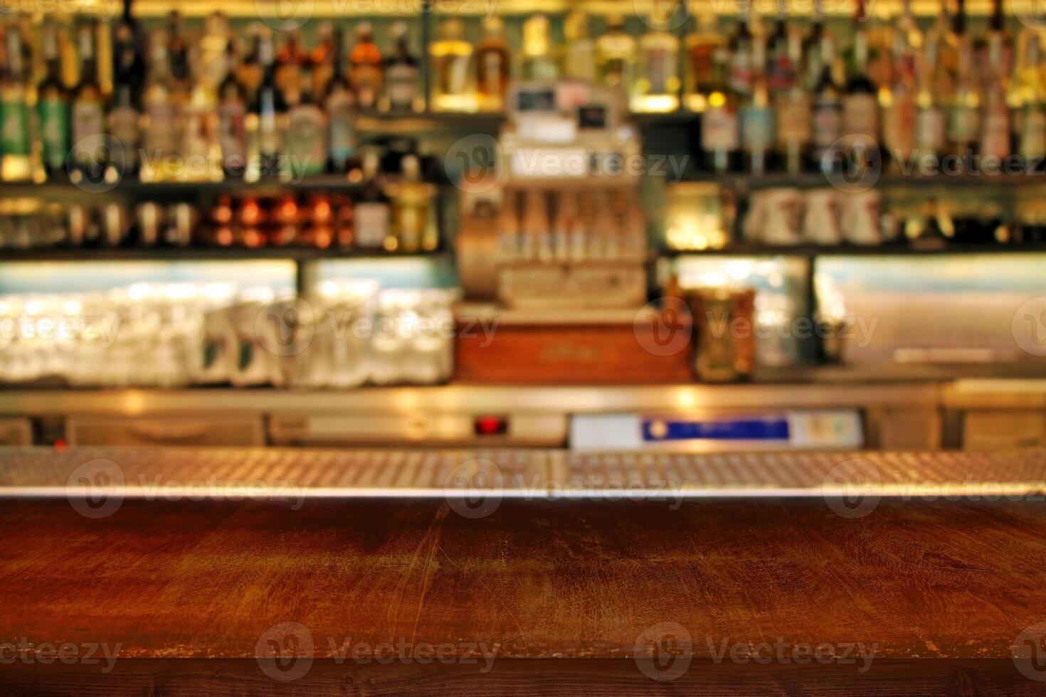 Interior of bar close-up. Classic defocused bar counter background. photo