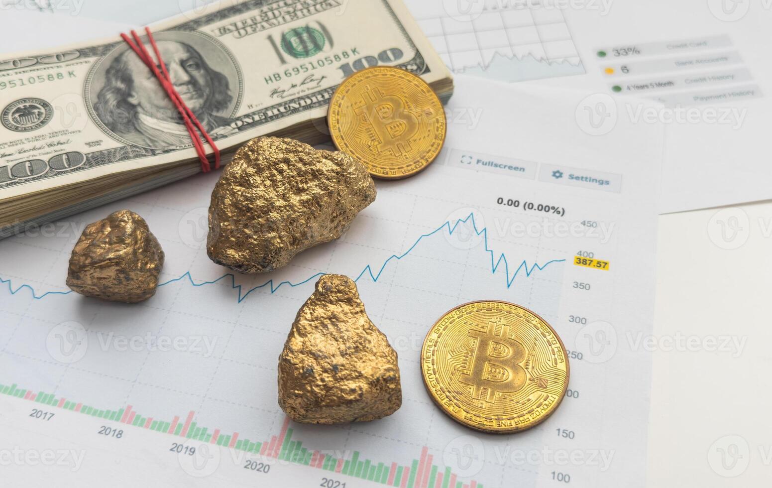 Economic concept. Crypto currency, money and gold on global stock markets. Three shiny bitcoin and two gold pieces lying on some EURO and US dollar banknotes. Black background with copy space photo