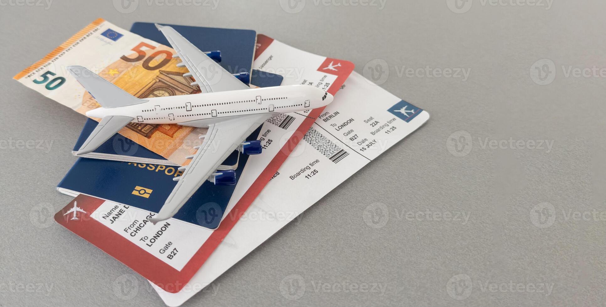 Preparation for Traveling concept, toy airplane, passport with copy space photo