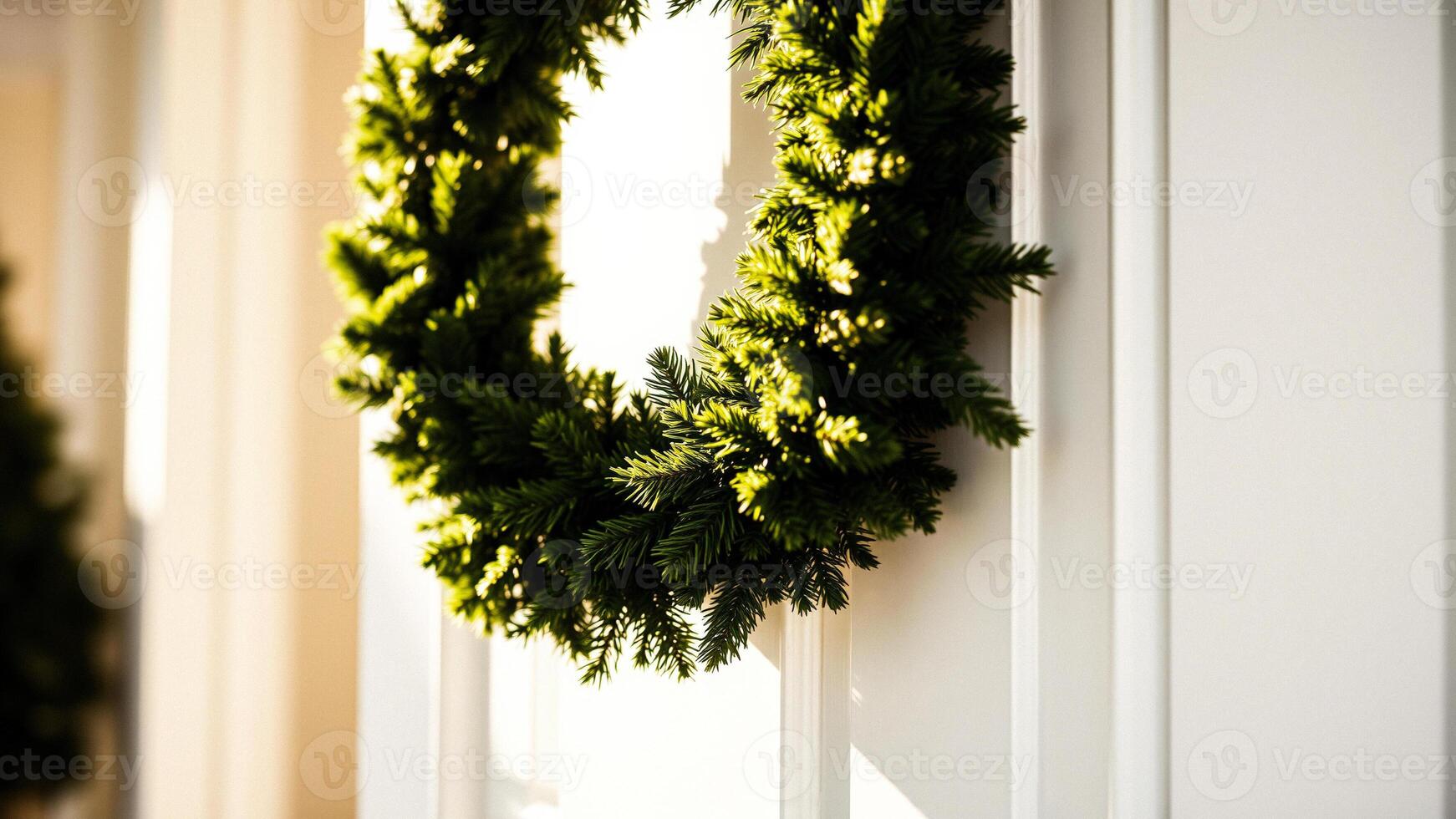 Green Christmas Wreath on White Wall photo