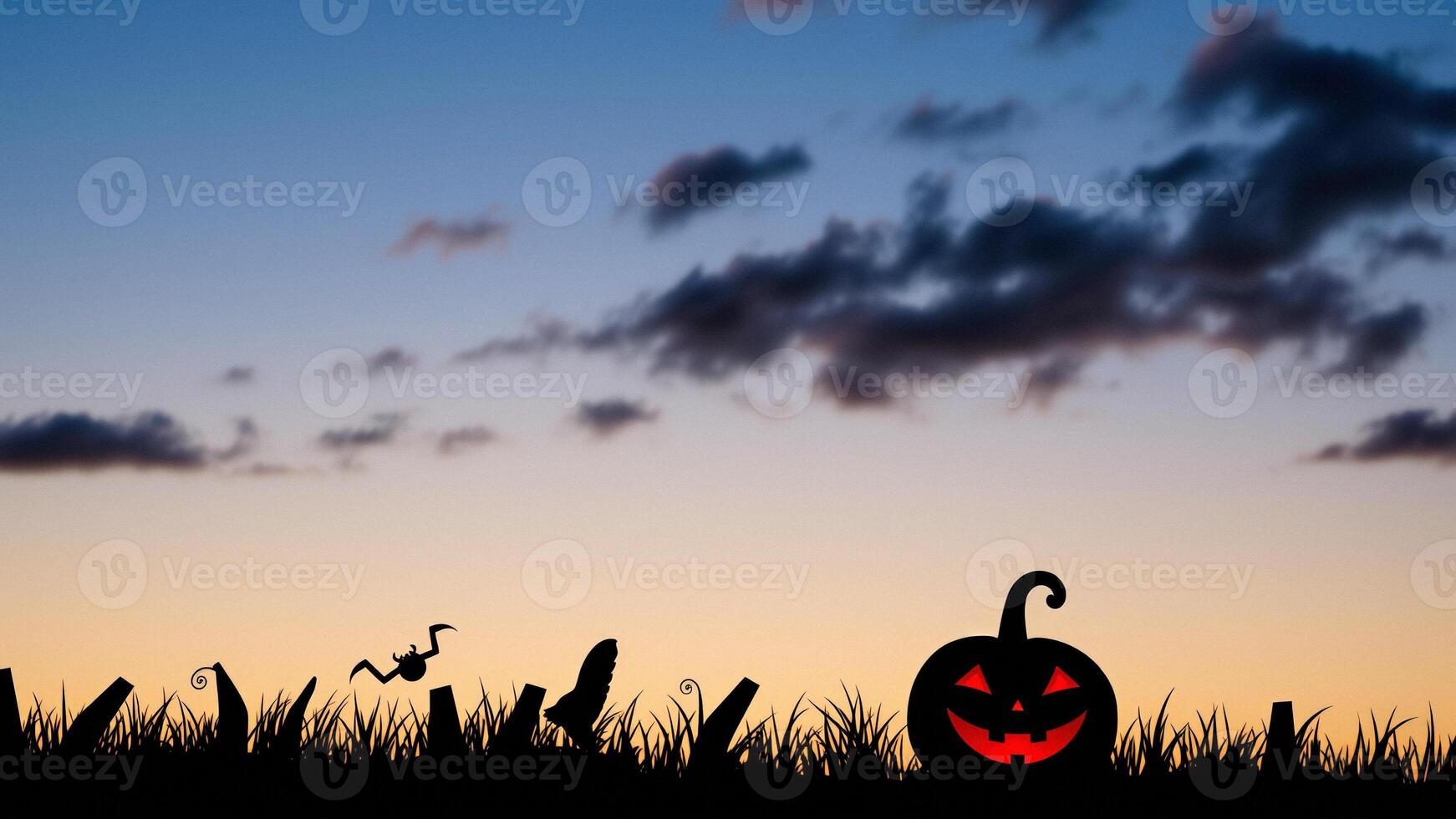 Halloween Pumpkin in Grass at Dusk photo