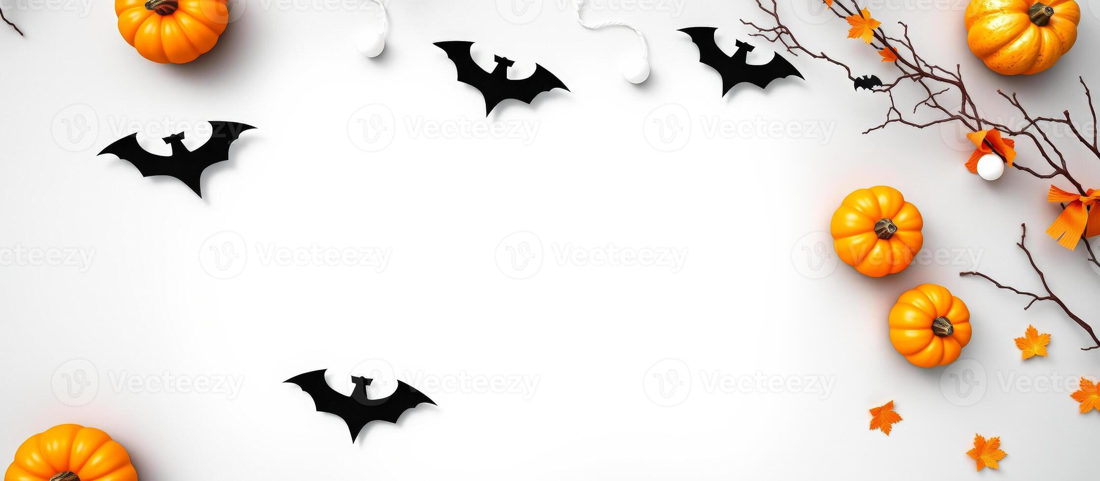 Halloween Flat Lay with Pumpkins, Bats, and Branches photo