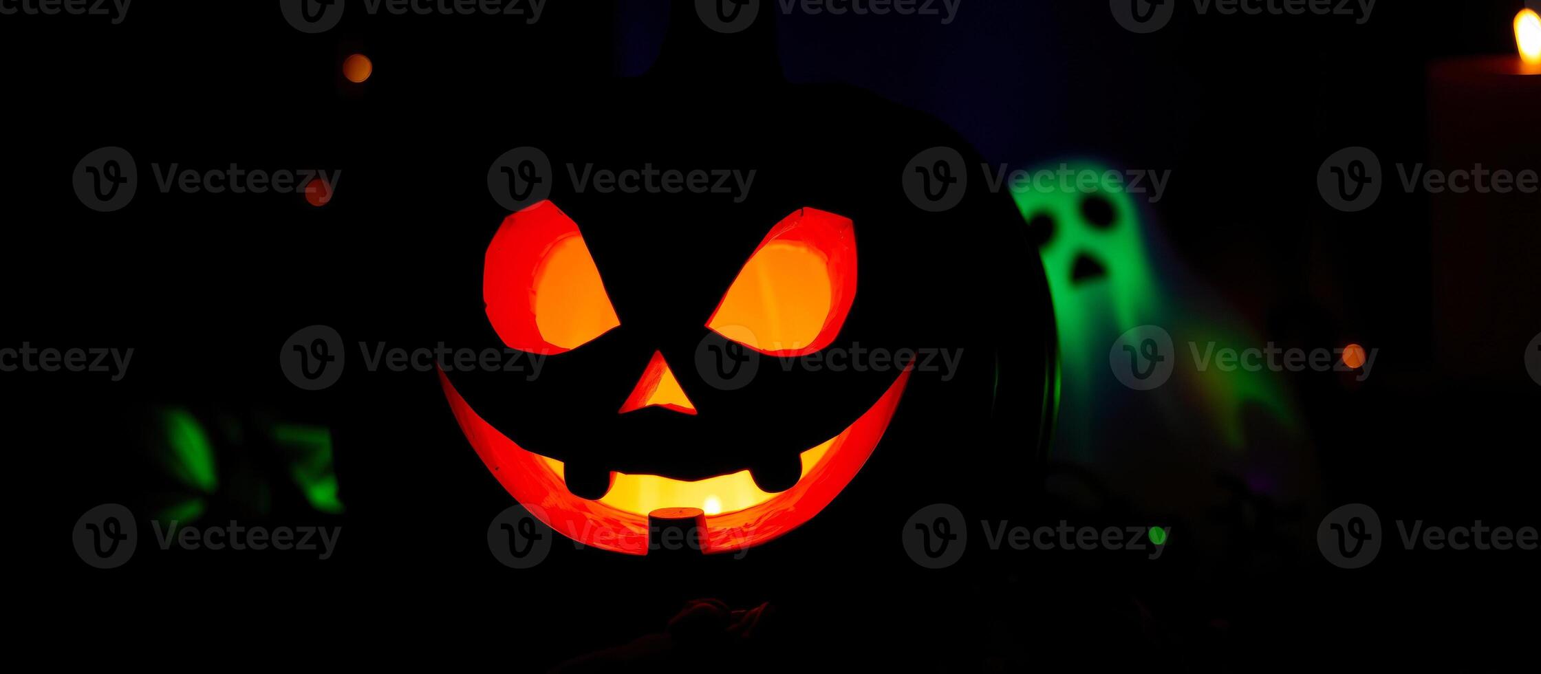 glowing jack-o'-lantern with a ghostly figure the background photo
